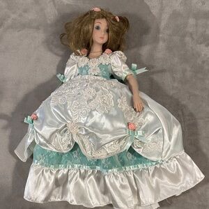 Vintage Porcelain Doll with Floral Accents